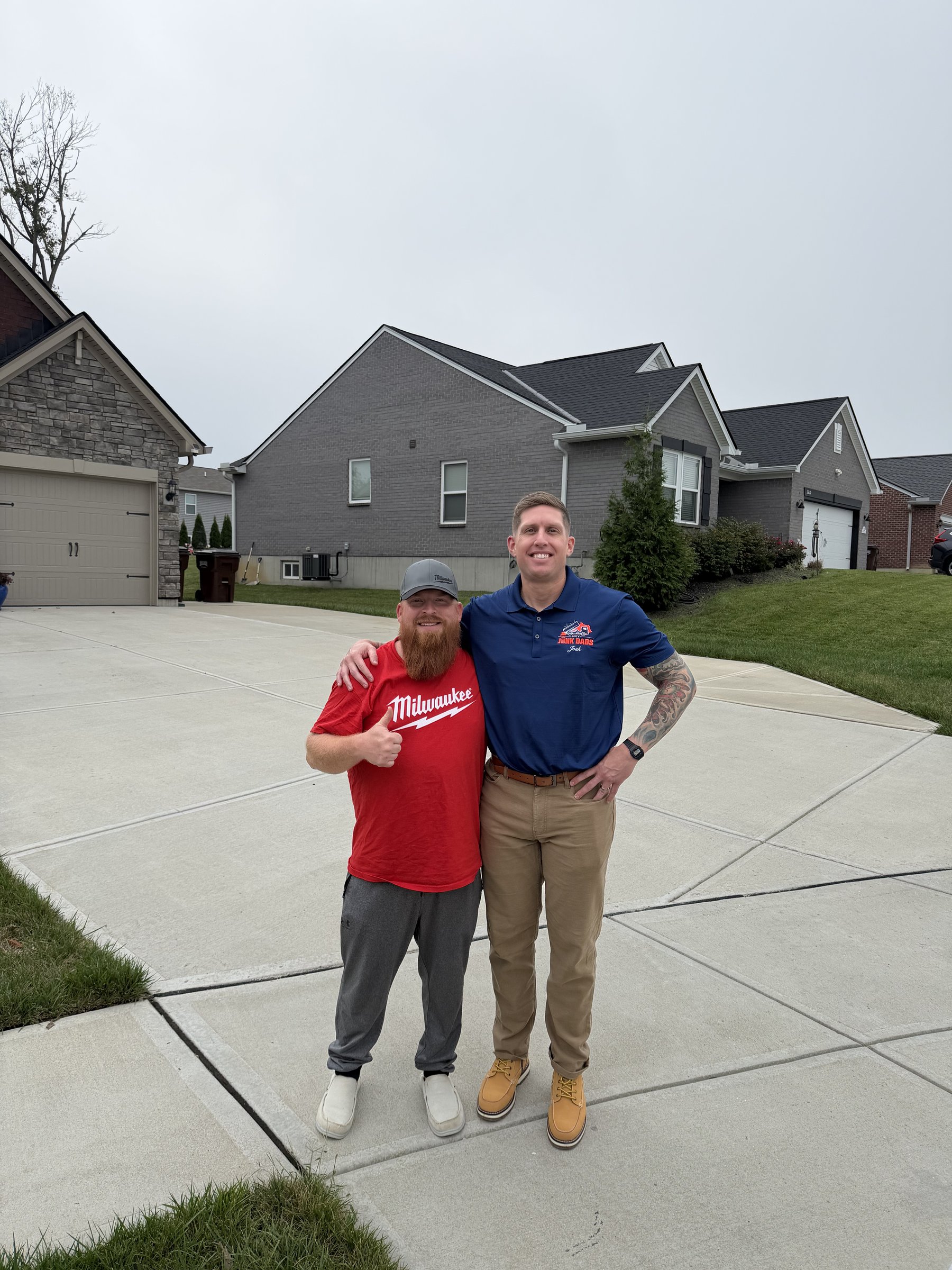 Josh from Junk Dads with a neighbor in a red shirt