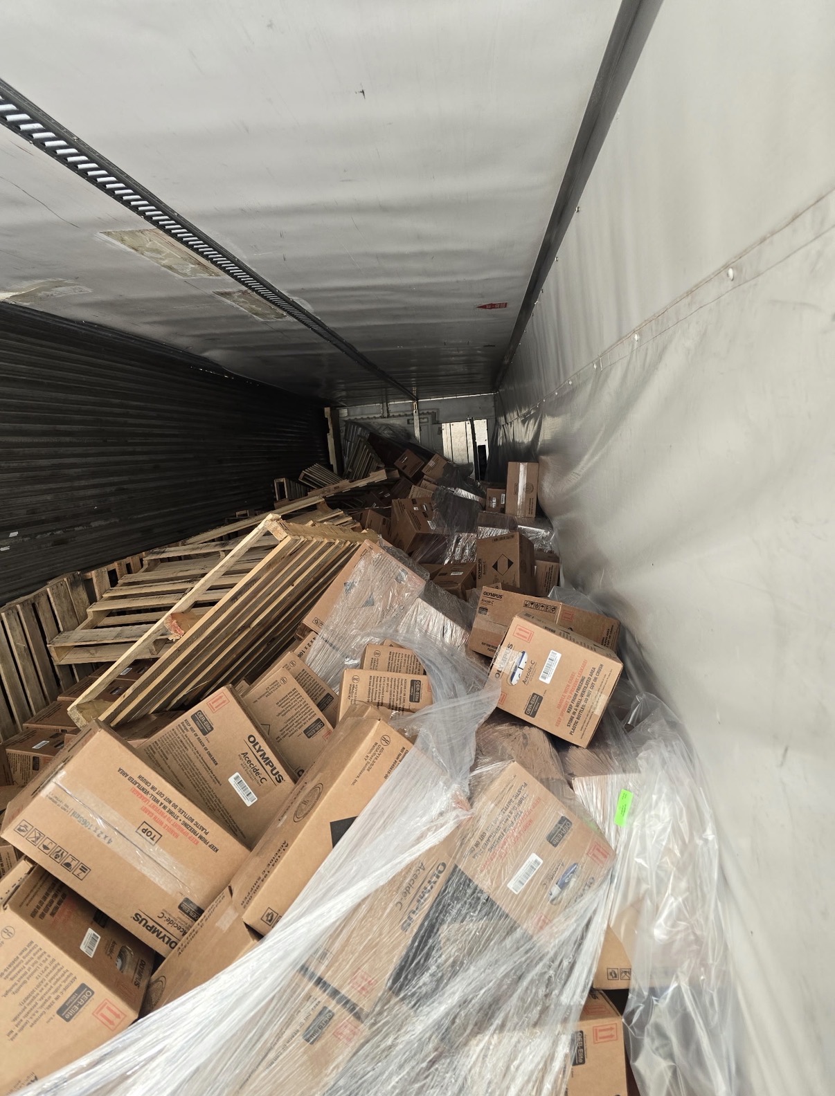 Semi trailer filled with pallets and boxes waiting to be cleared